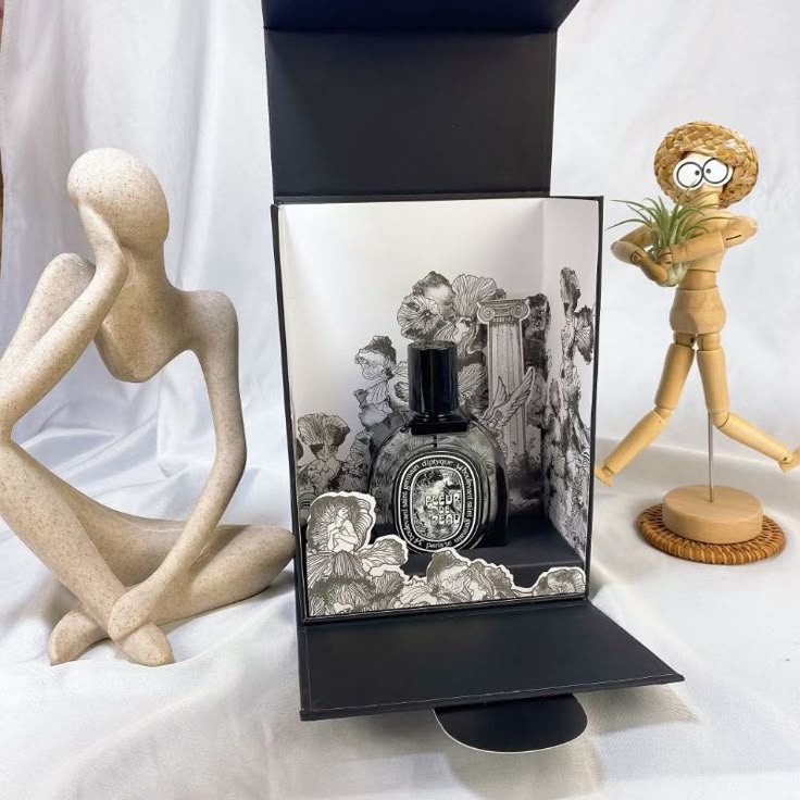 Printing Parisian art onto a box — buy the perfume, keep a drawing.